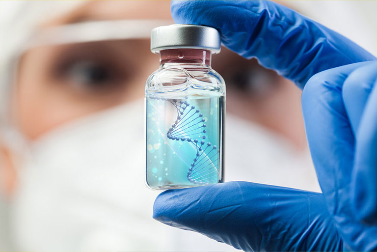 Scientist looking at molecule in vial